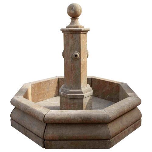 Fuente de jardín octogonal de piedra con una columna central y un remate esférico